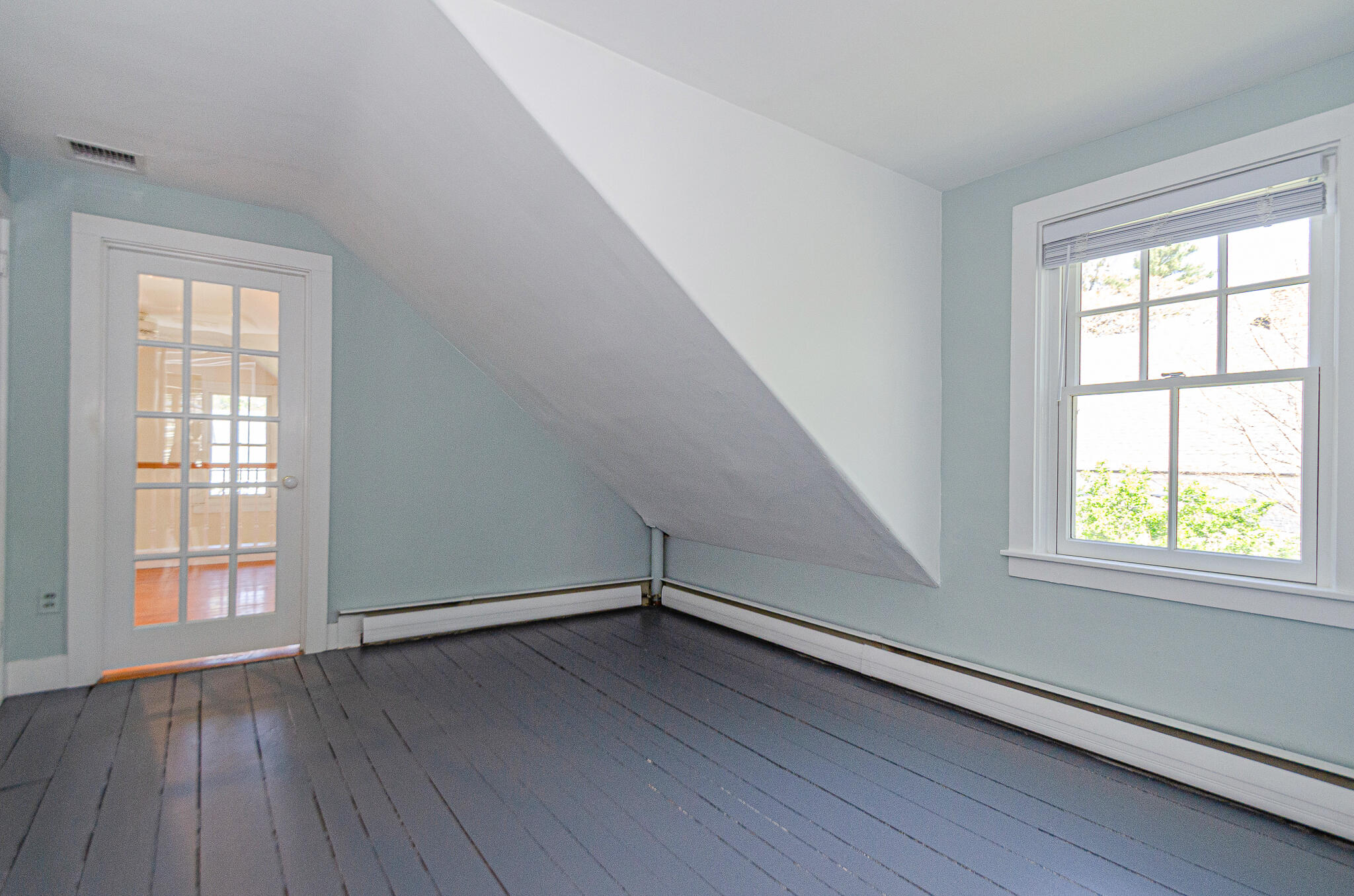 1089 Main Street Cotuit, MA 02635 - Photo 24 of 41 an empty room with wooden floor and windows