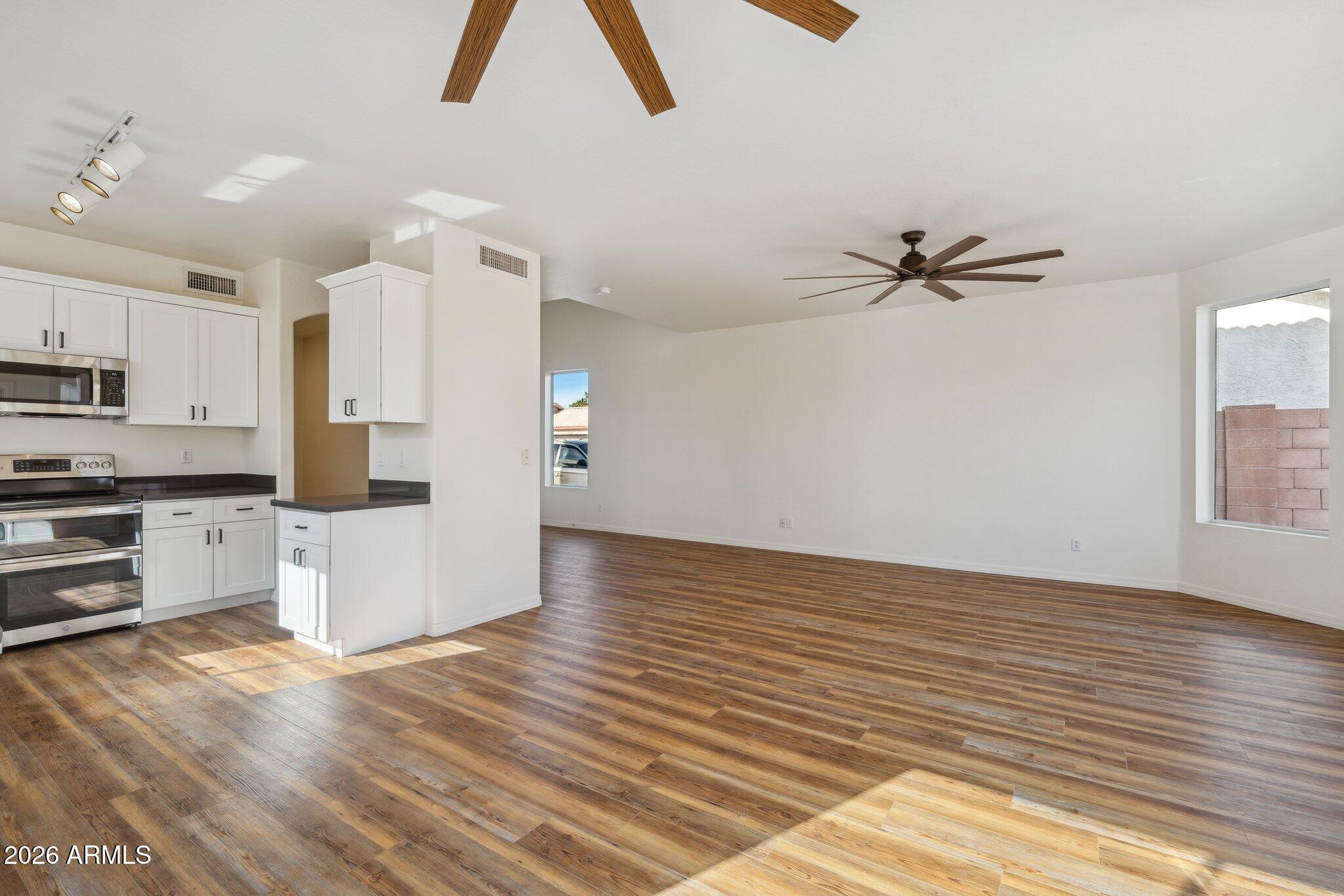 4034 East Chambers Street Phoenix, AZ 85040 - Photo 8 of 26 a view of kitchen and wooden floor