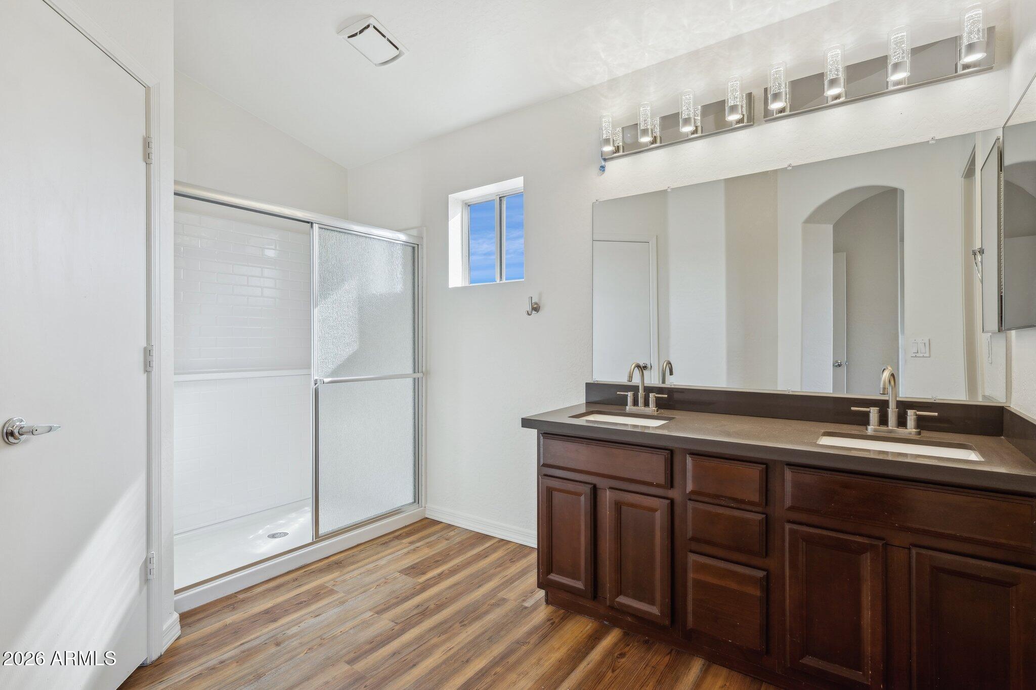 4034 East Chambers Street Phoenix, AZ 85040 - Photo 15 of 26 a bathroom with a double vanity sink and mirror