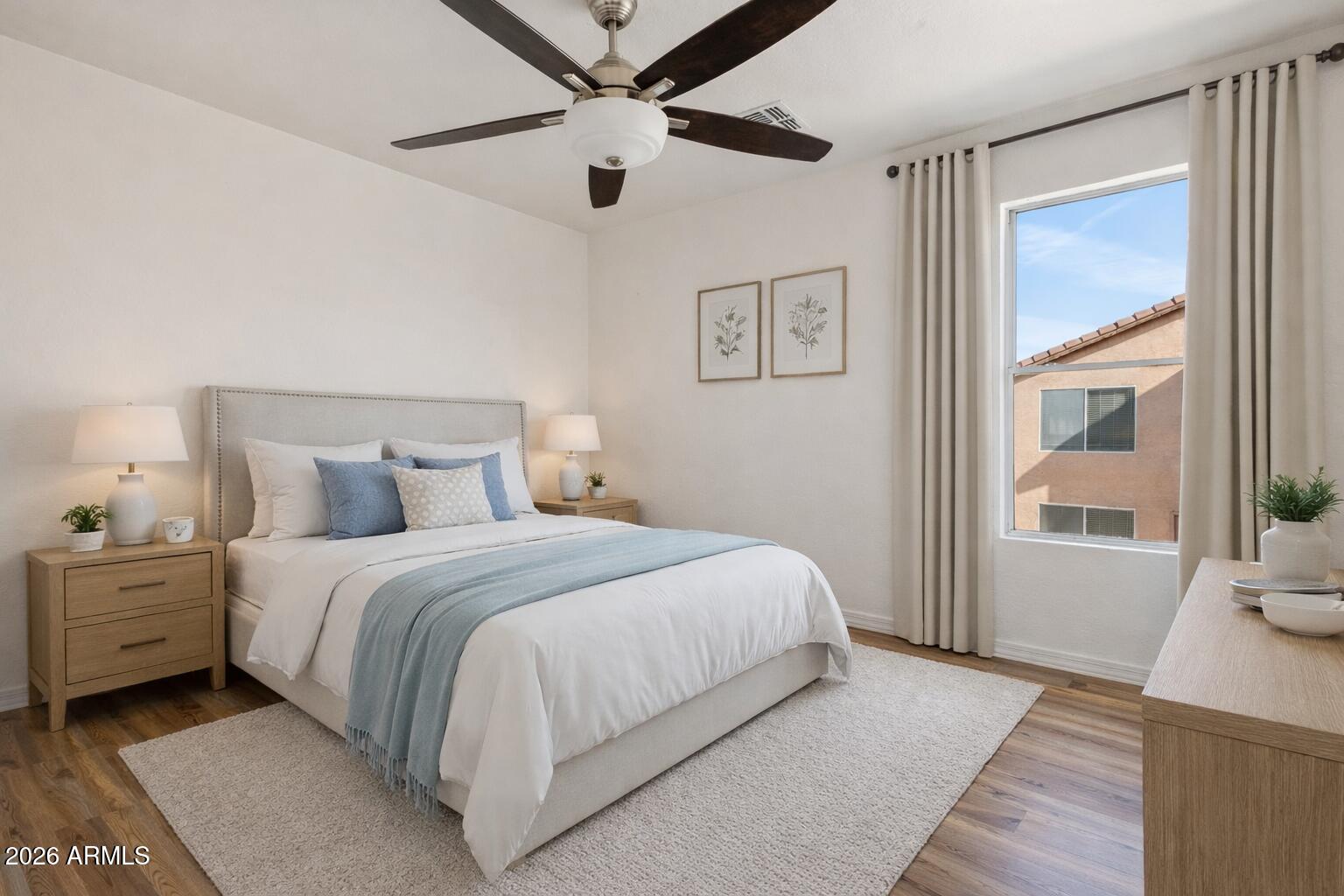 4034 East Chambers Street Phoenix, AZ 85040 - Photo 17 of 26 a bedroom with a large bed and a window