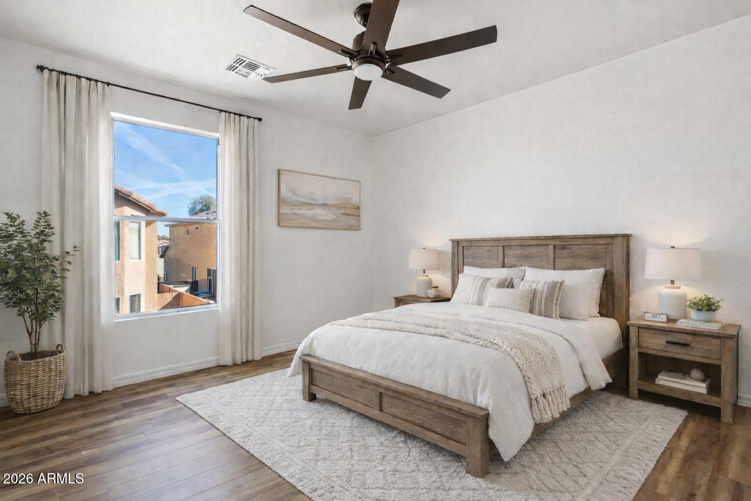 4034 East Chambers Street Phoenix, AZ 85040 - Photo 19 of 26 a bedroom with a large bed and a window