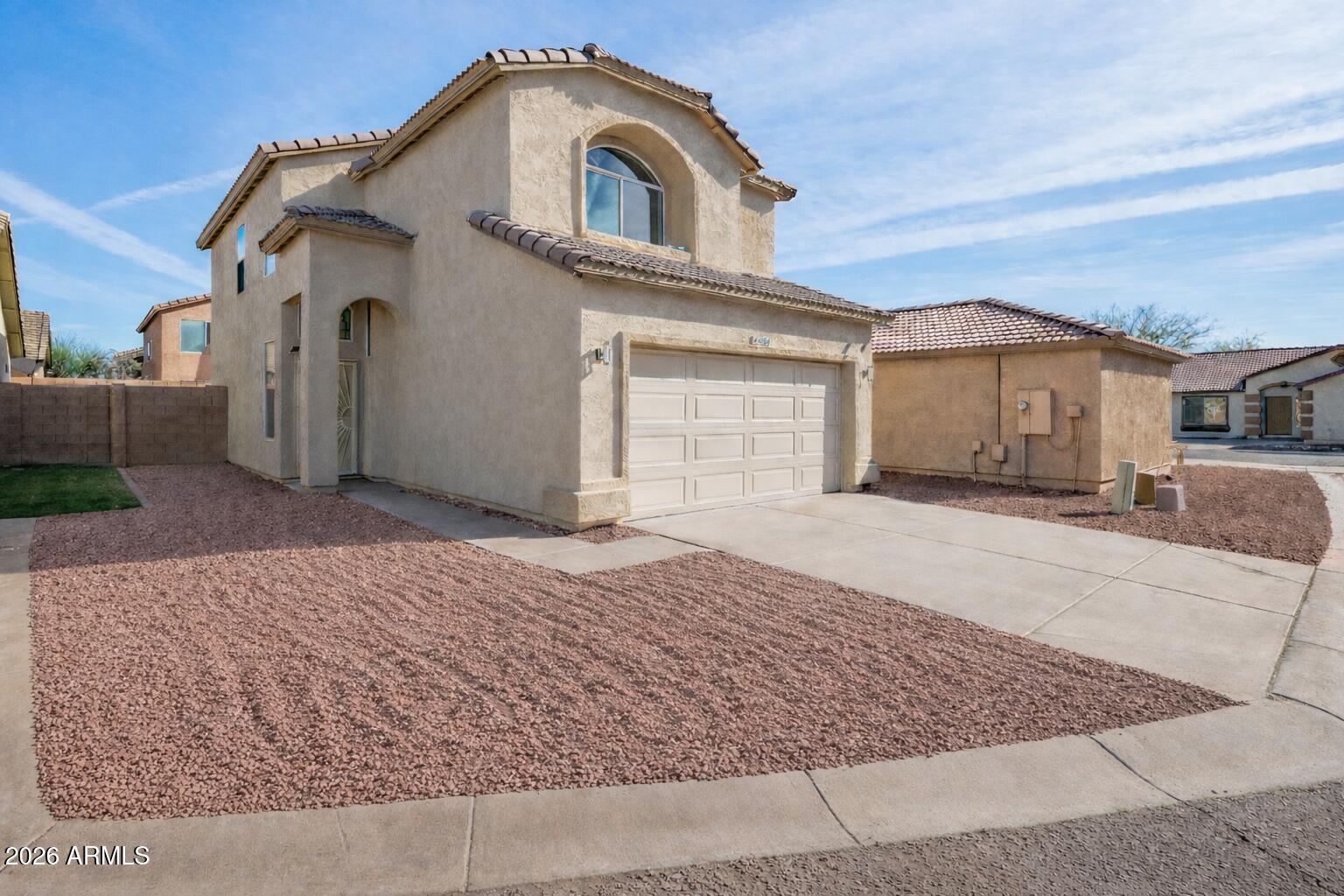 4034 East Chambers Street Phoenix, AZ 85040 - Photo 2 of 26 a front view of a house with a yard