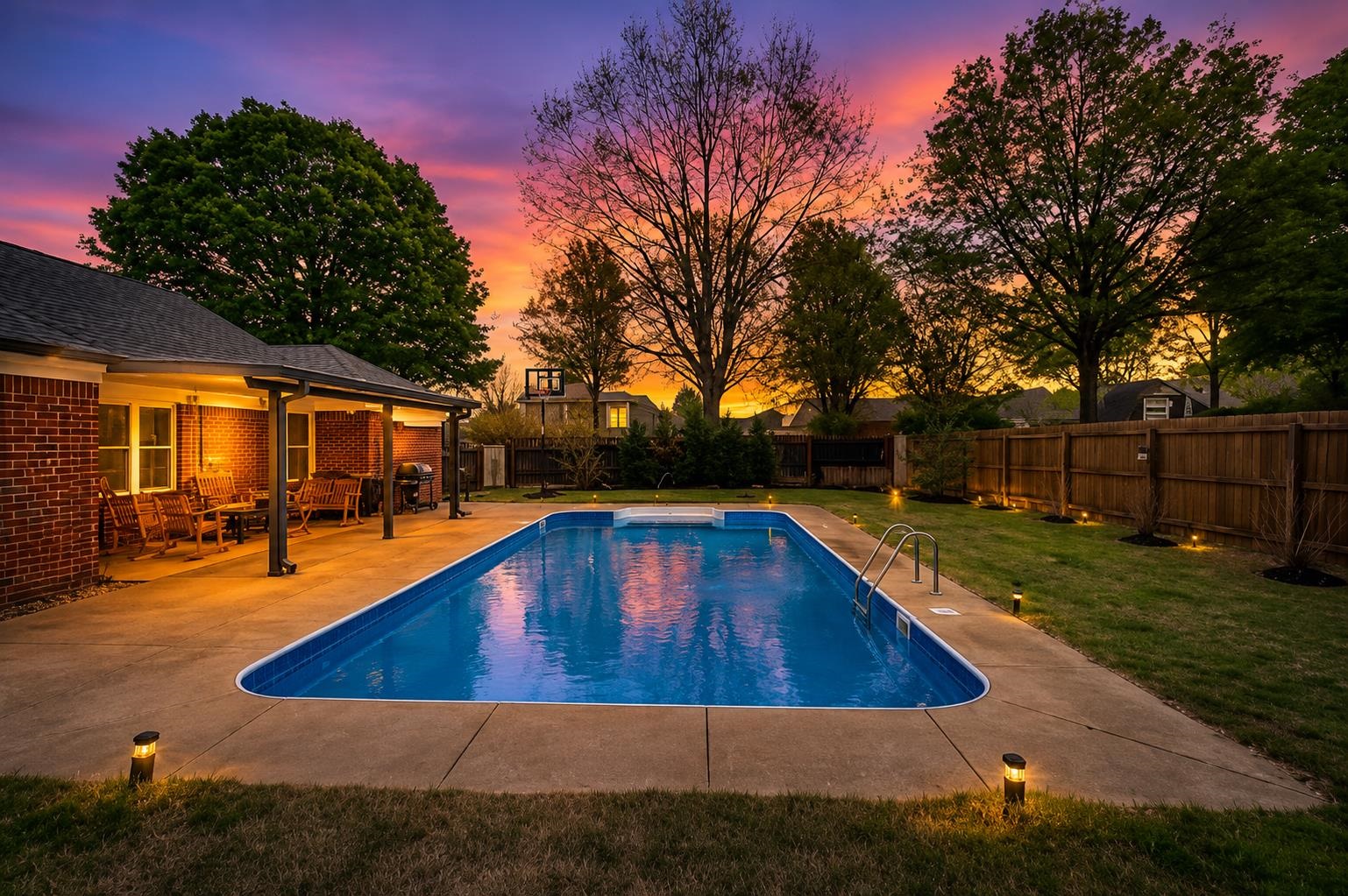9333 Breakstone Cove Collierville, TN 38017 - Photo 1 of 39 Resort-style backyard oasis! Enjoy a sparkling in-ground pool, expansive covered patio, and breathtaking sunset views. Perfect for entertaining or relaxing, this private retreat offers the blend of comfort, &outdoor living. Image has been virtually staged