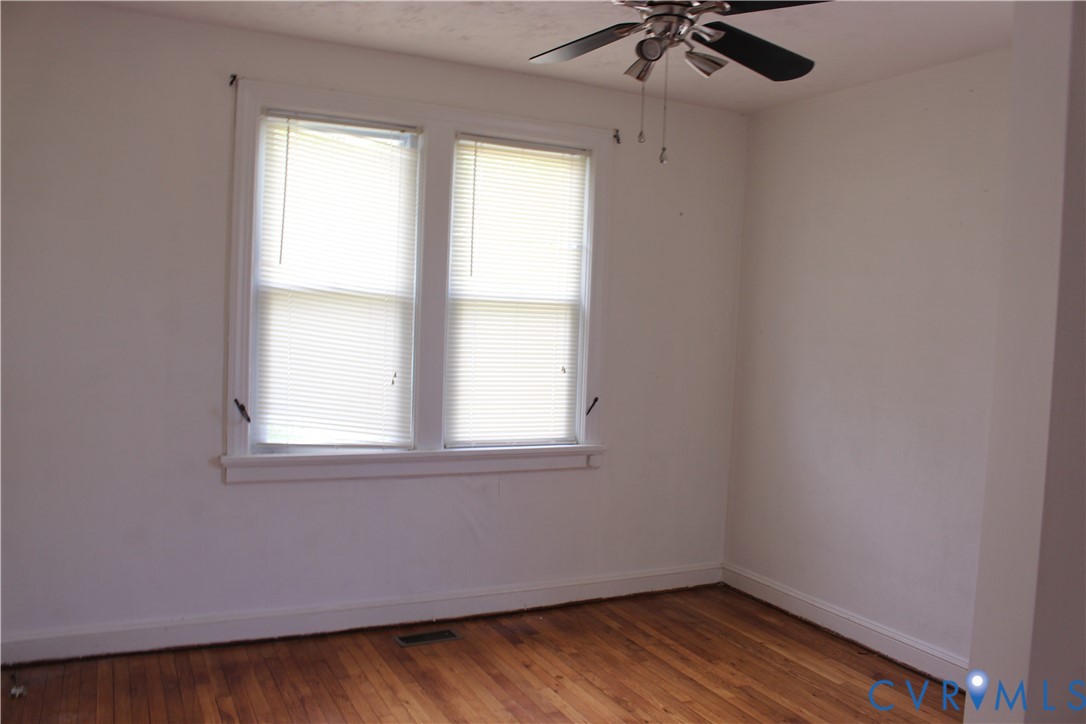 710 Colonial Avenue Colonial Heights, VA 23834 - Photo 13 of 14 an empty room with a window and a fan