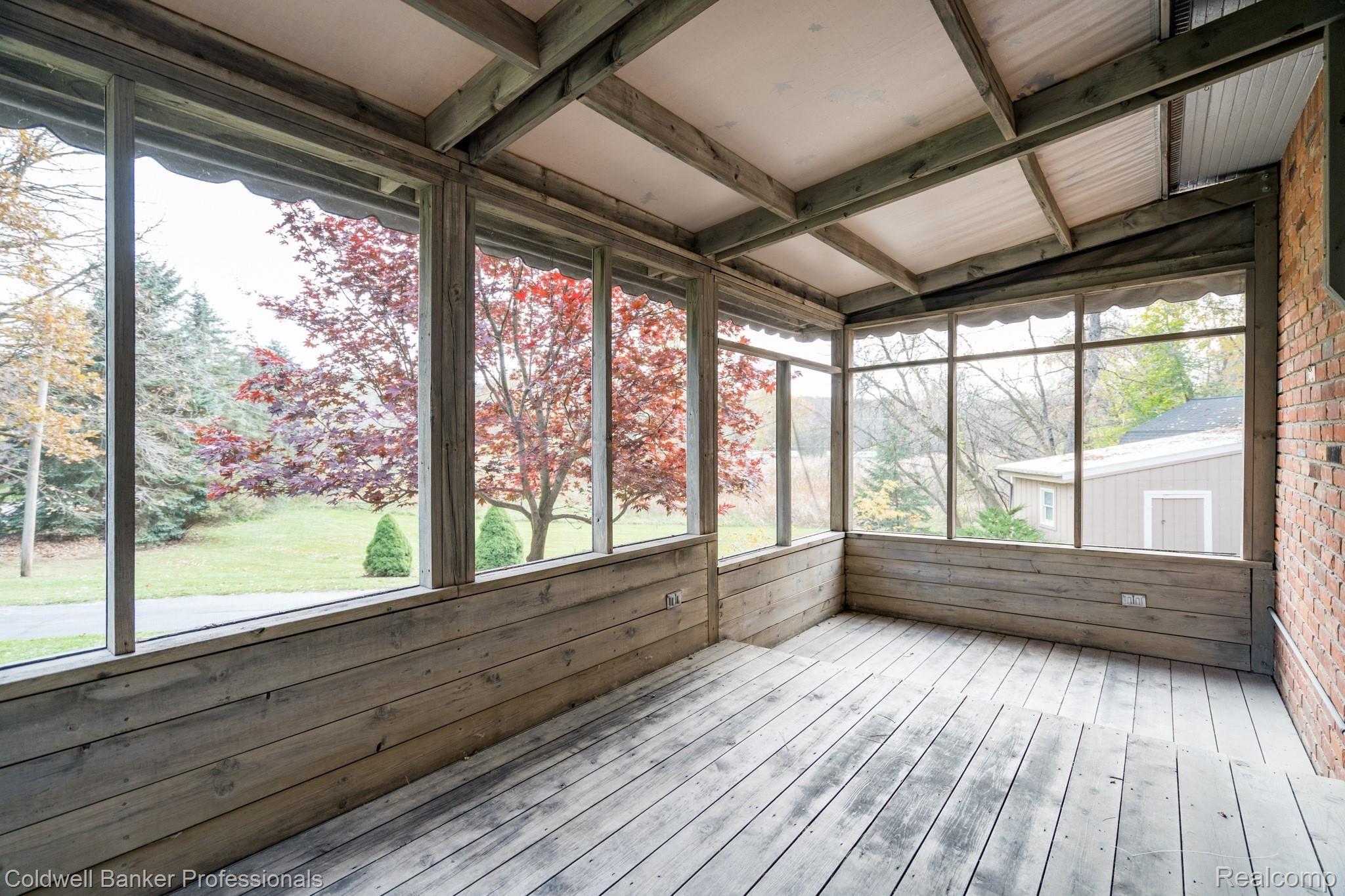1277 Dutton Road Rochester, MI 48306 - Photo 27 of 37 Beautiful sun porch on side of house