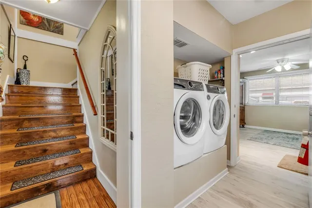 a kitchen with stainless steel appliances kitchen island granite countertop a sink and cabinets