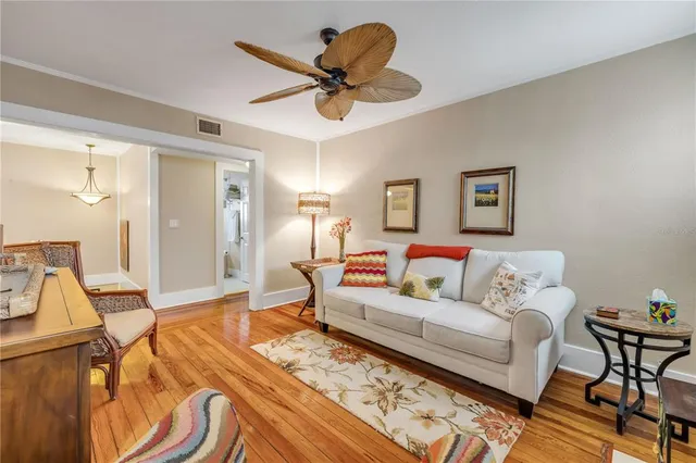 a bedroom with a bed and a flat tv screen on dresser
