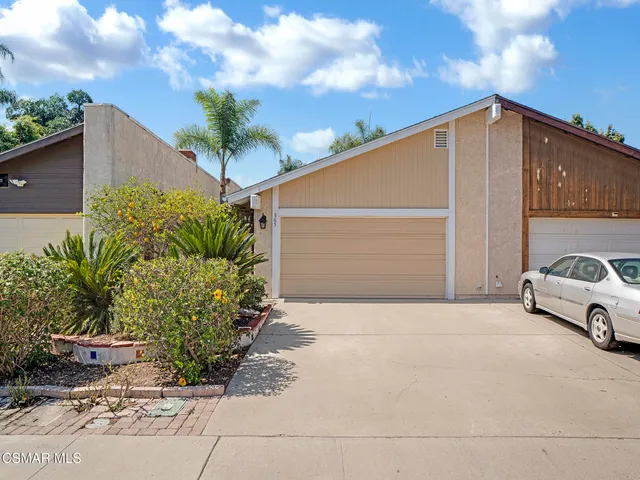 a house view with a garden space