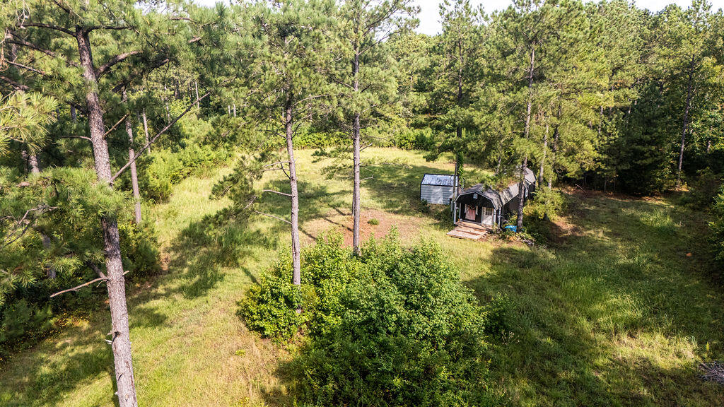 33-ac Crosscreek Road Edgefield, SC 29824 - Photo 20 of 25 a backyard of a building with large trees