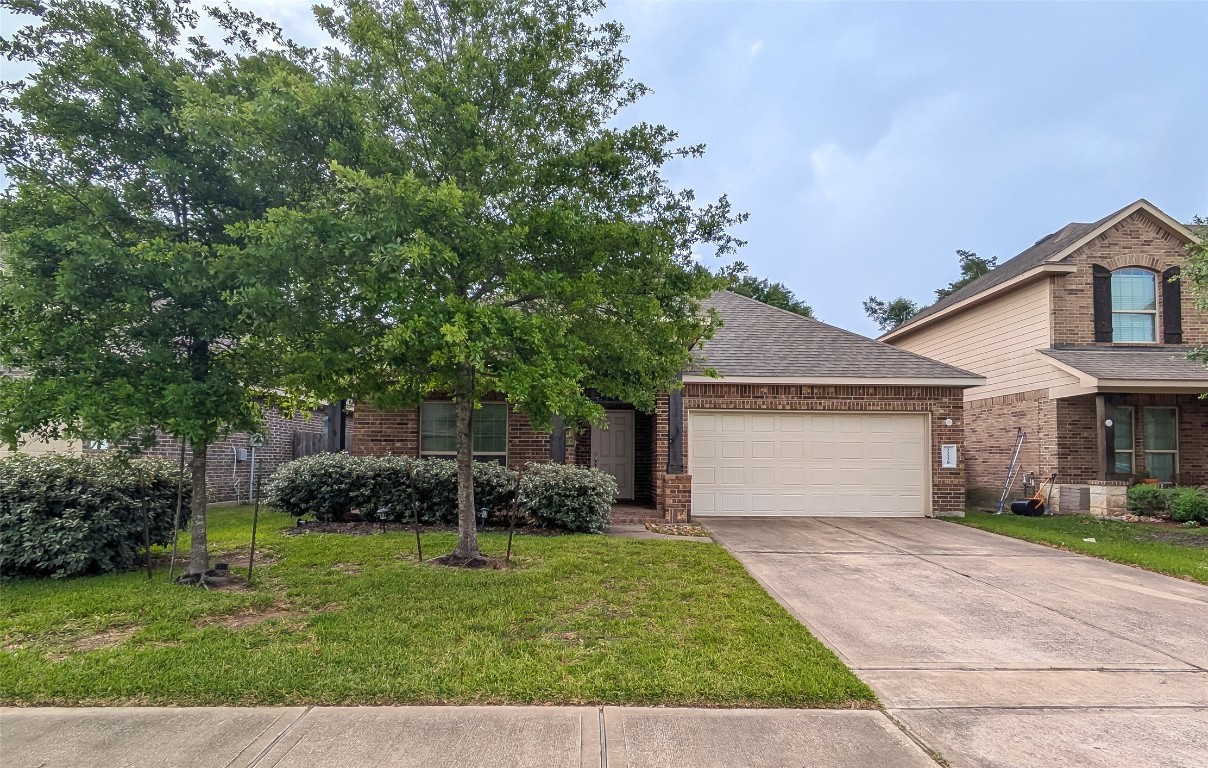 22330 Forbes Field Trail Spring, TX 77389 - Photo 8 of 8 a front view of a house with garden