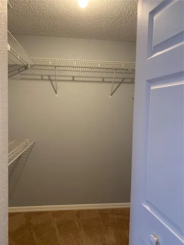 a view of a room with racks on the wall