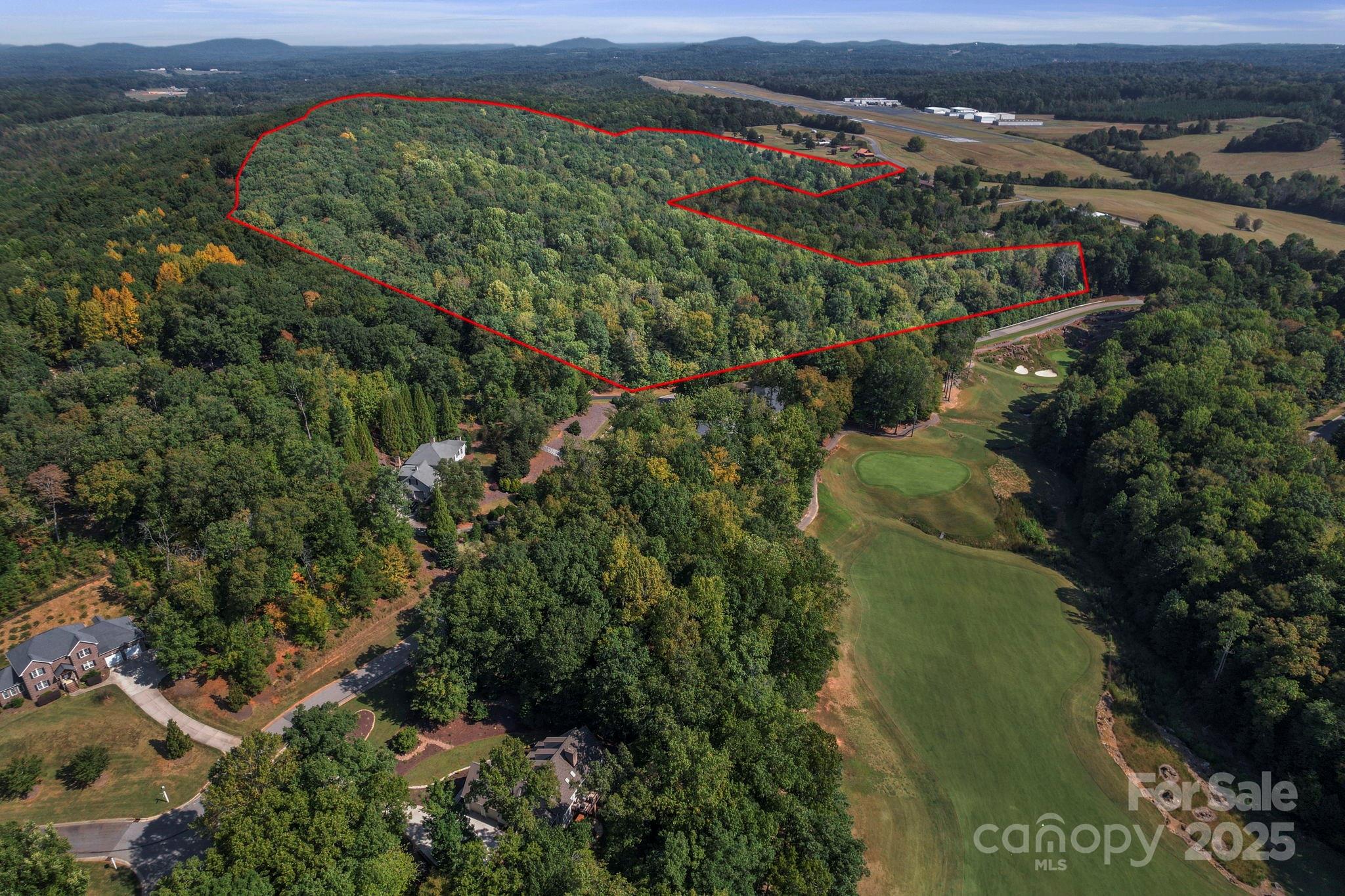 2272 Doul Mountain Road Asheboro, NC 27205 - Photo 2 of 27 an aerial view of a city and mountain view in back