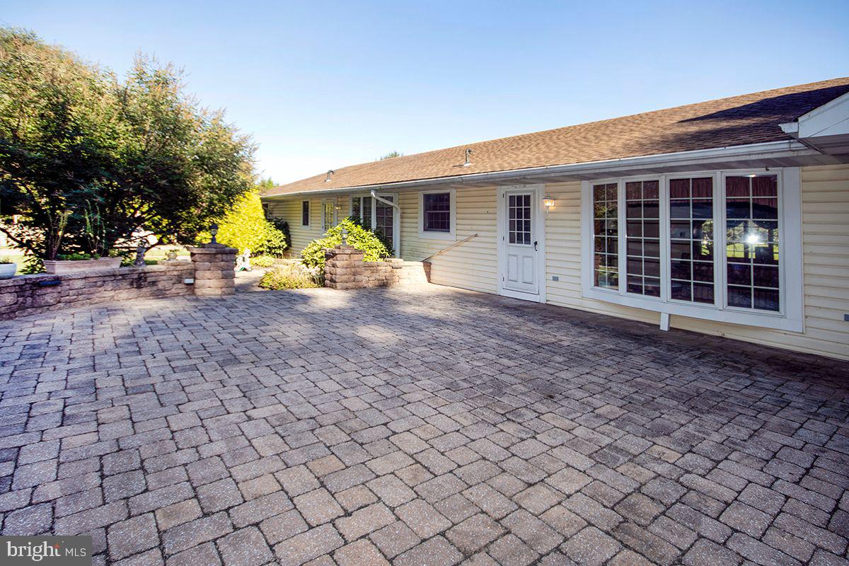 25 Layton Road Pilesgrove, NJ 08098 - Photo 14 of 40 Exterior Back: Paver Patio w Ext Lighting