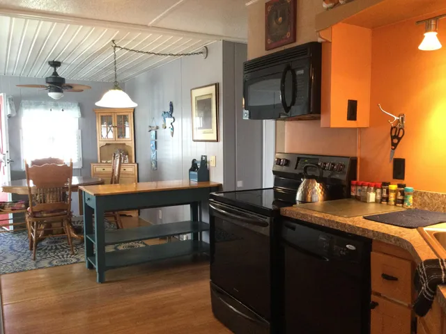 a kitchen with a sink cabinets and window