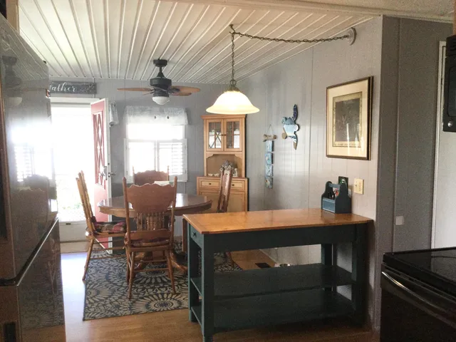 a dining room with a table and chairs