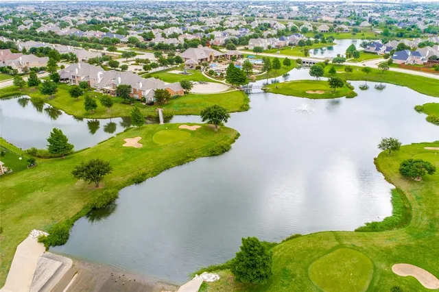 an aerial view of a house with swimming pool and outdoor space