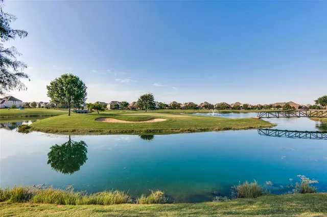 a view of a water fountain in front of house