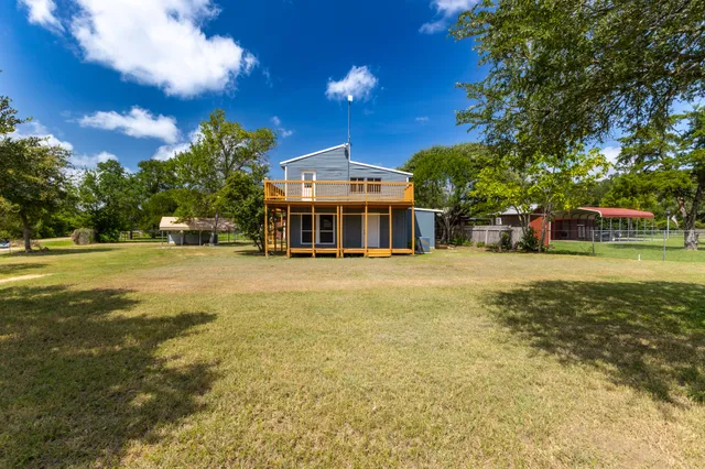 a view of a house with a big yard
