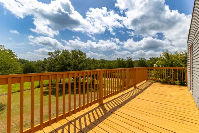 a view of wooden balcony with city view