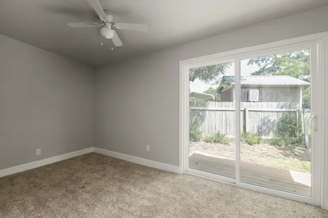 an empty room with a fireplace