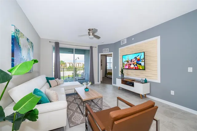 a living room with furniture and a flat screen tv