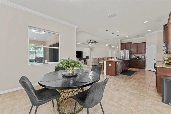 a kitchen with a table and chairs in it