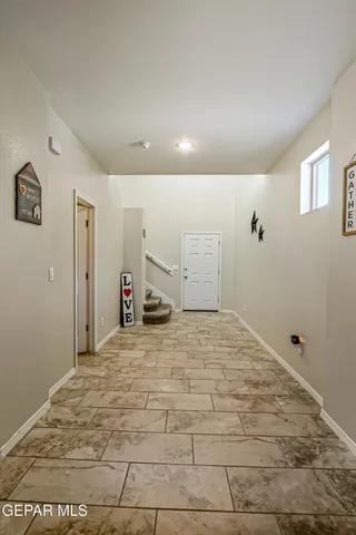 a view of a room with a bed