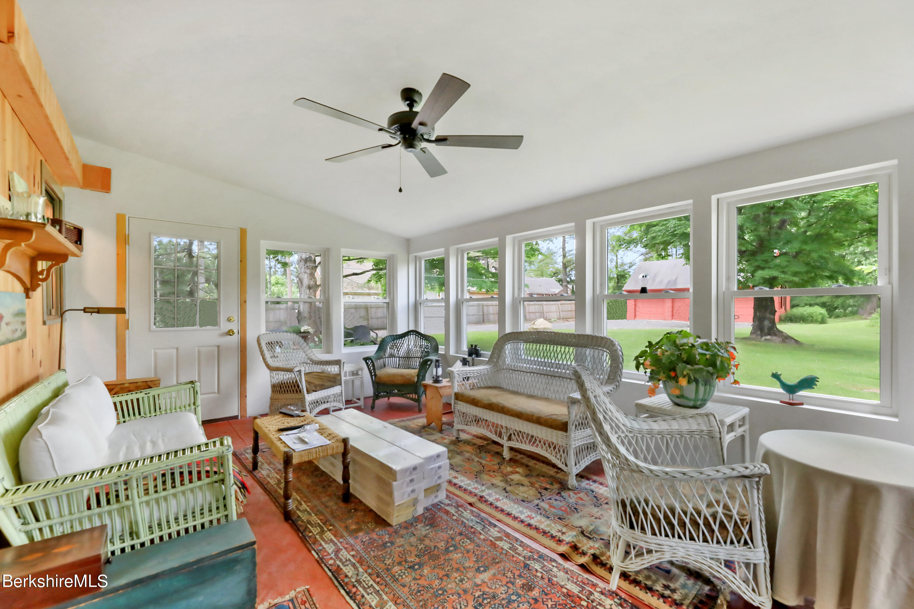 575 Sheffield Plain Sheffield, MA 01257 - Photo 11 of 42 a living room with furniture and a floor to ceiling window