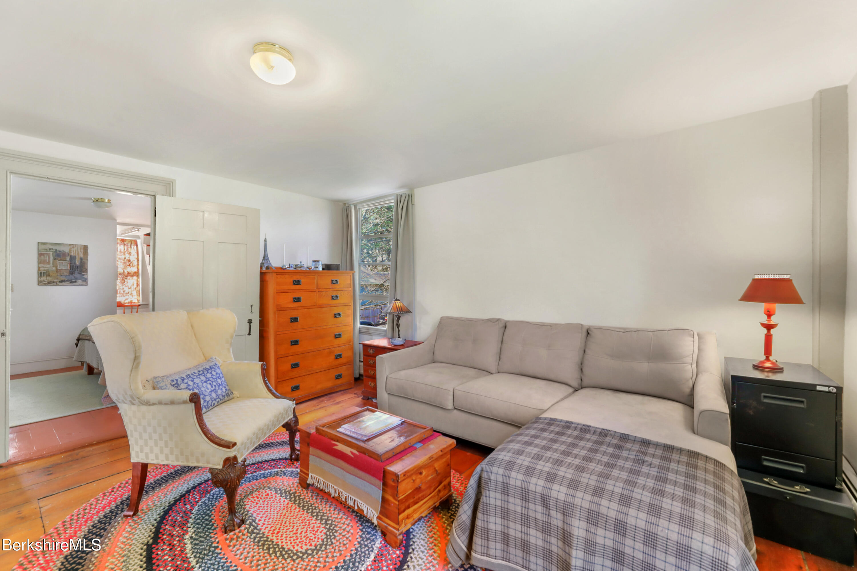 575 Sheffield Plain Sheffield, MA 01257 - Photo 22 of 42 a living room with furniture a flat screen tv and a lamp