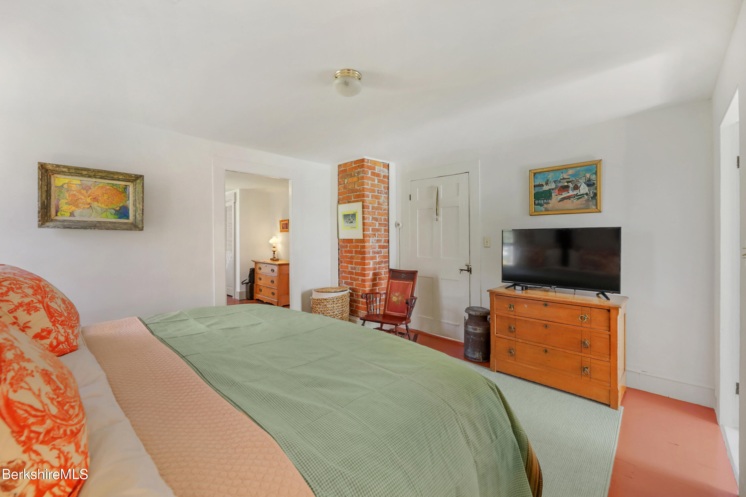 575 Sheffield Plain Sheffield, MA 01257 - Photo 26 of 42 a bedroom with a bed and wooden floor