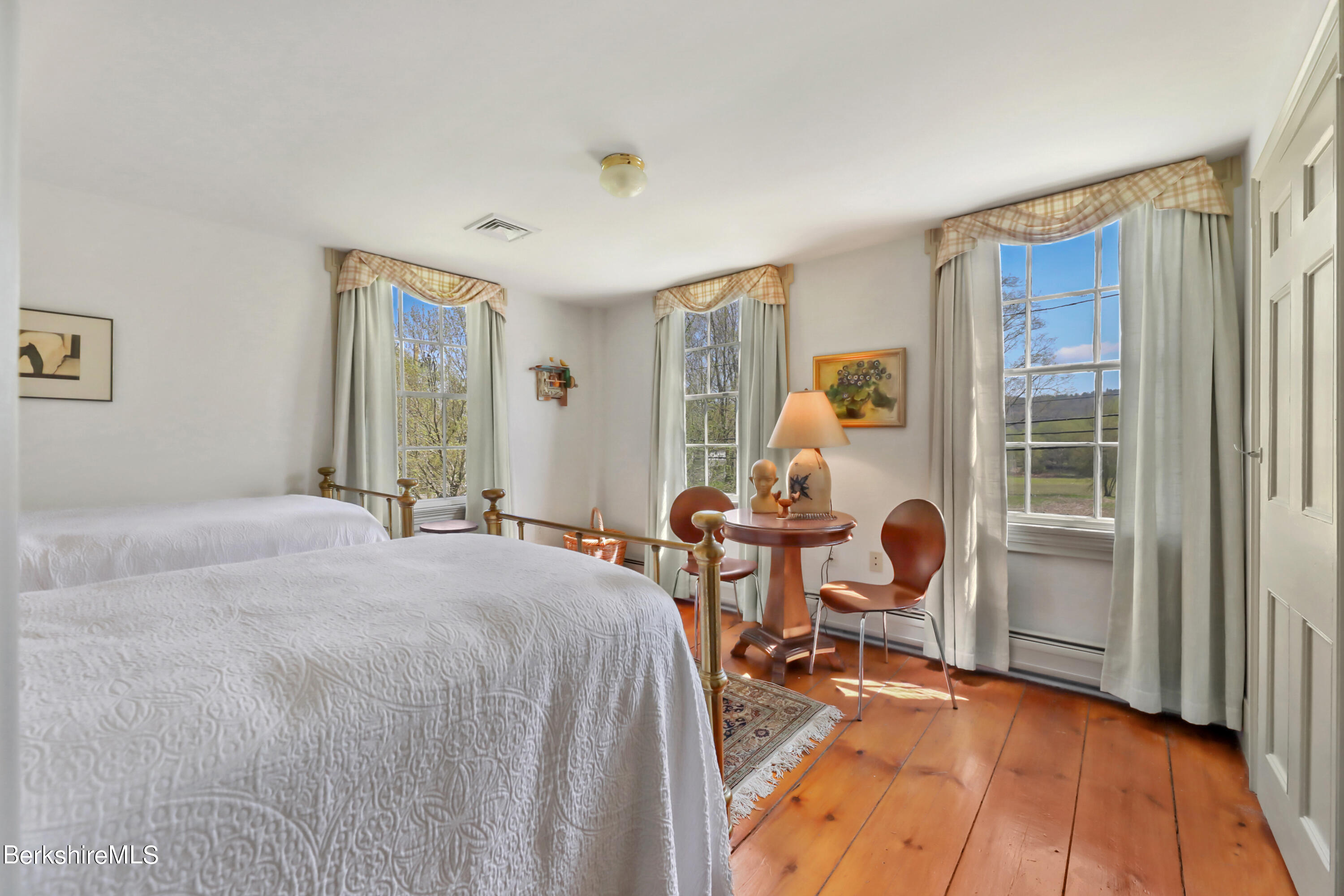 575 Sheffield Plain Sheffield, MA 01257 - Photo 29 of 42 a bedroom with a bed and wooden floor