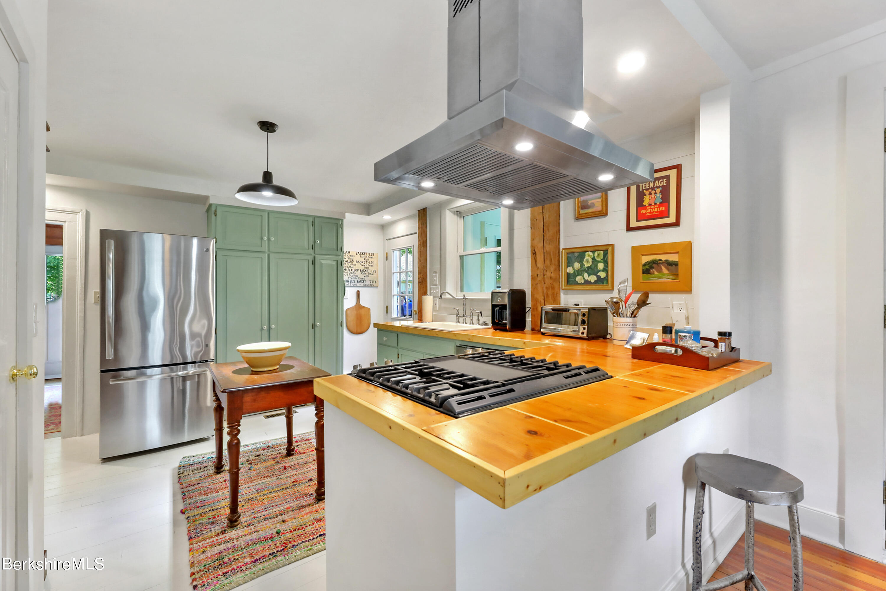 575 Sheffield Plain Sheffield, MA 01257 - Photo 3 of 42 a kitchen with stainless steel appliances granite countertop a stove a refrigerator and a dining table