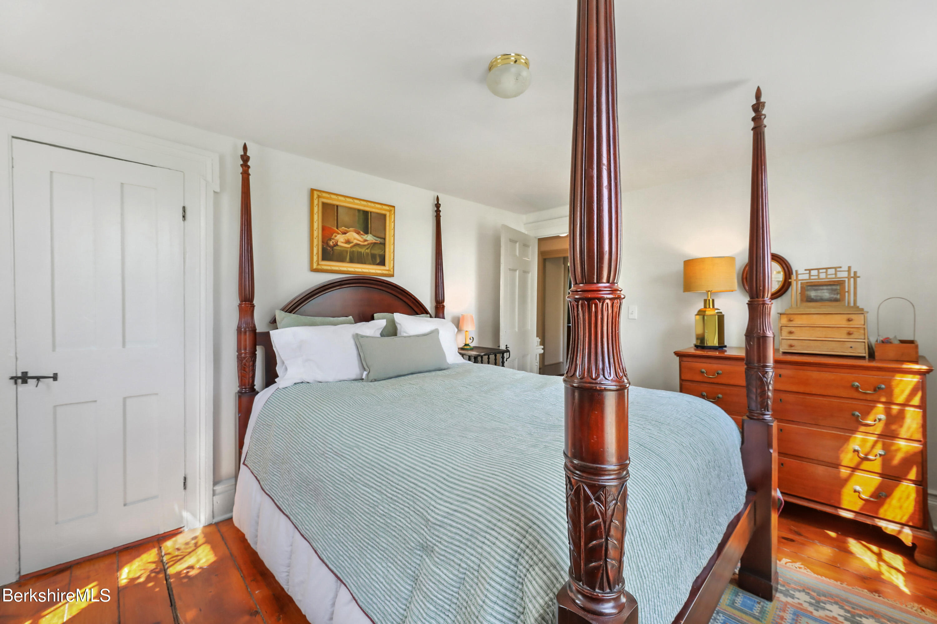 575 Sheffield Plain Sheffield, MA 01257 - Photo 33 of 42 a bedroom with a bed and wooden floor