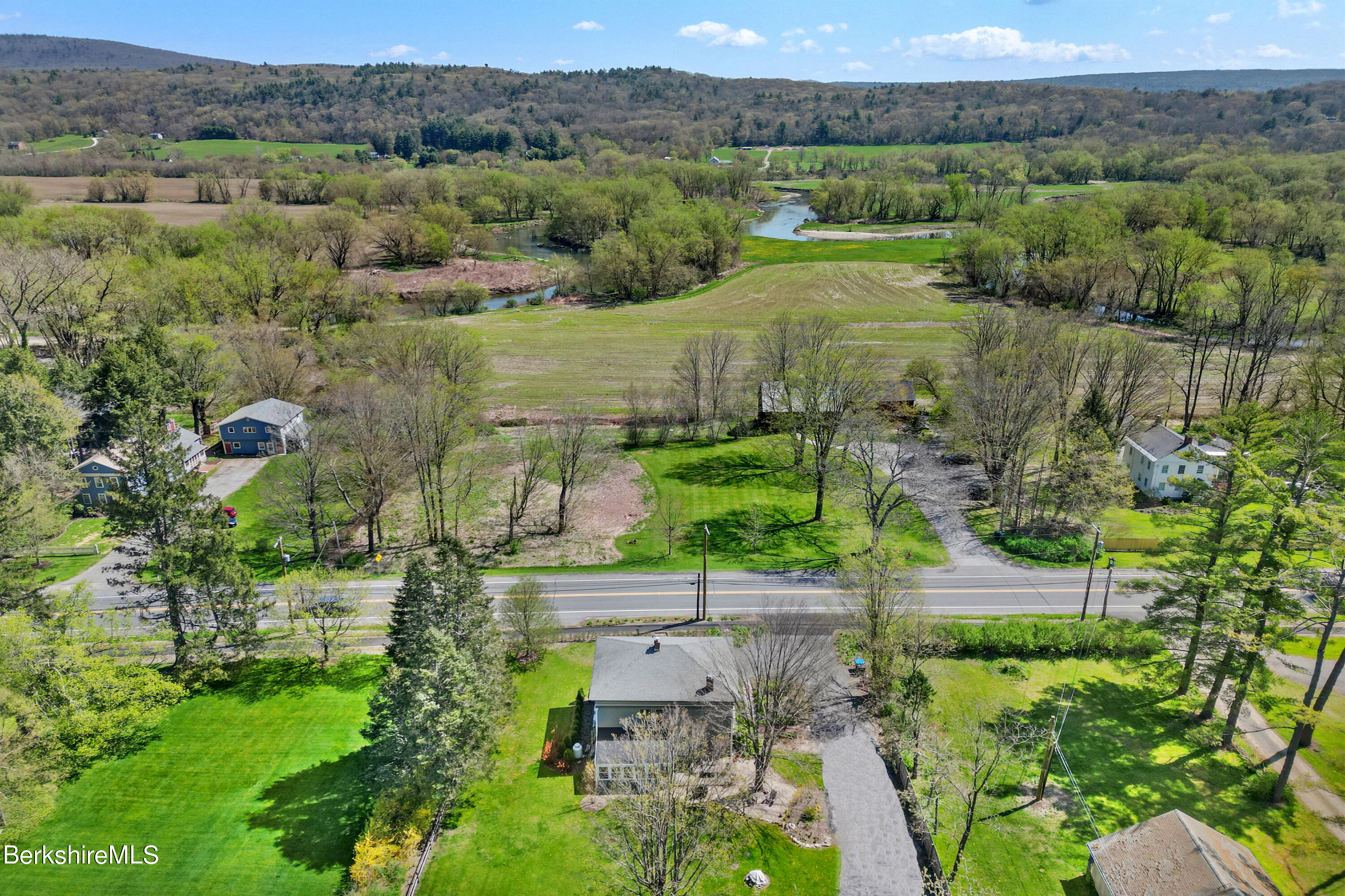 575 Sheffield Plain Sheffield, MA 01257 - Photo 42 of 42 an aerial view of green landscape with trees houses and mountain view