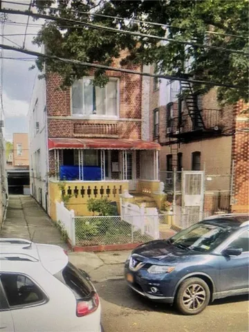 a front view of a house with parking