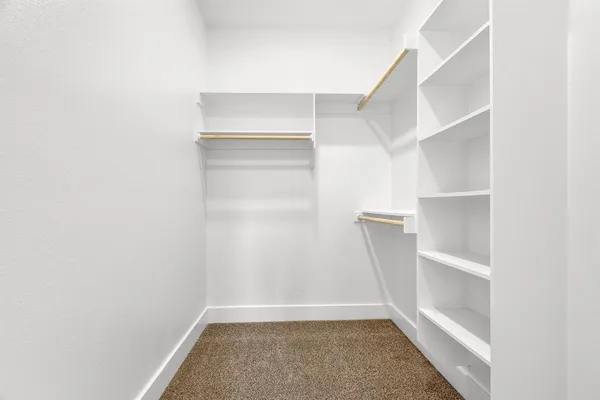 a view of an empty walk in closet