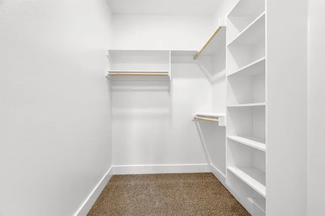 a view of an empty walk in closet