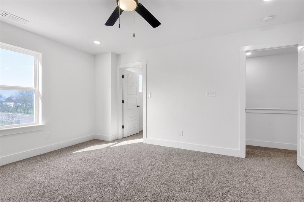 301 Anderson Street, Unit B Whitesboro, TX 76273 - Photo 13 of 16 a view of an empty room with a window