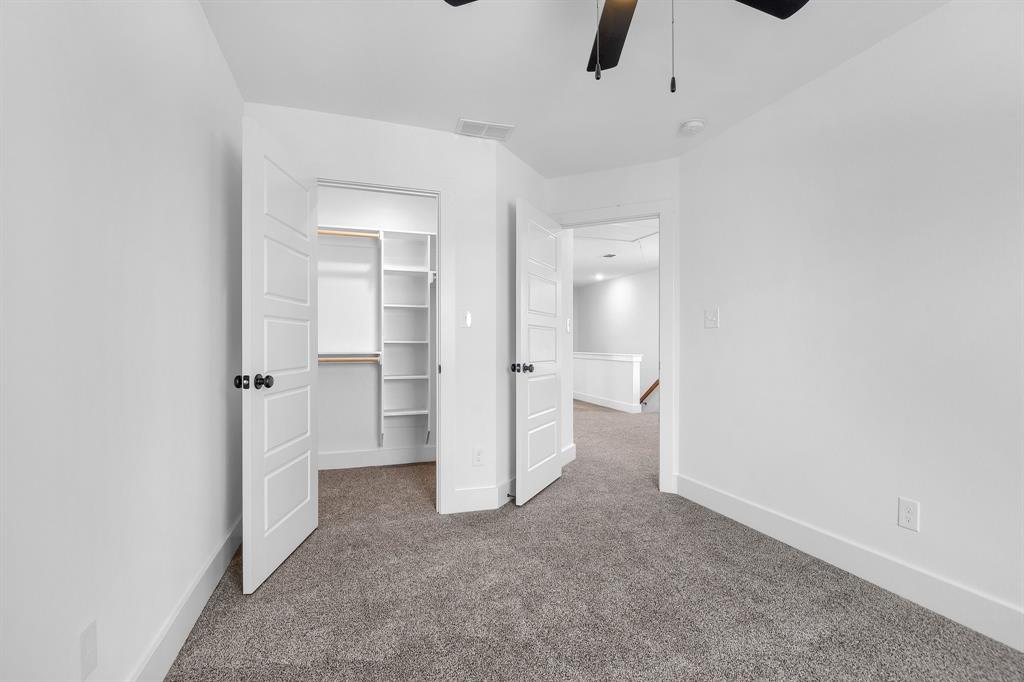 301 Anderson Street, Unit B Whitesboro, TX 76273 - Photo 14 of 16 an empty room with an empty space and a ceiling fan