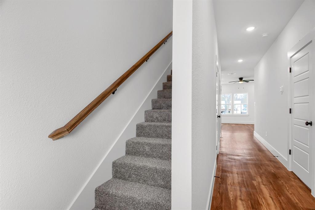 301 Anderson Street, Unit B Whitesboro, TX 76273 - Photo 8 of 16 a view of a hallway with wooden floor and staircase
