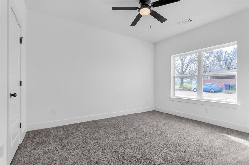 301 Anderson Street, Unit B Whitesboro, TX 76273 - Photo 9 of 16 a view of an empty room with a window