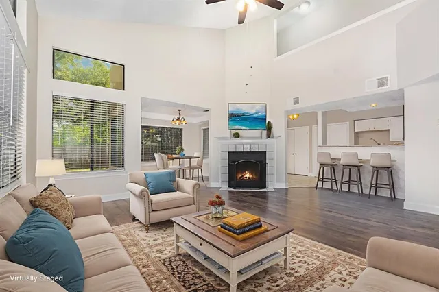 a living room with furniture and a fireplace