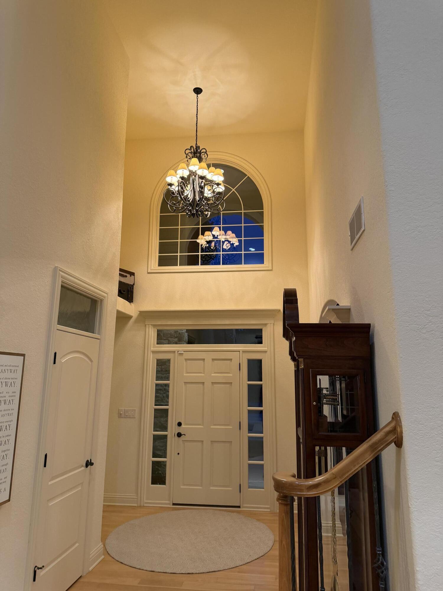 264 Steeple Pointe Circle Delafield, WI 53018 - Photo 10 of 120 Towering ceiling with stunning chandelier