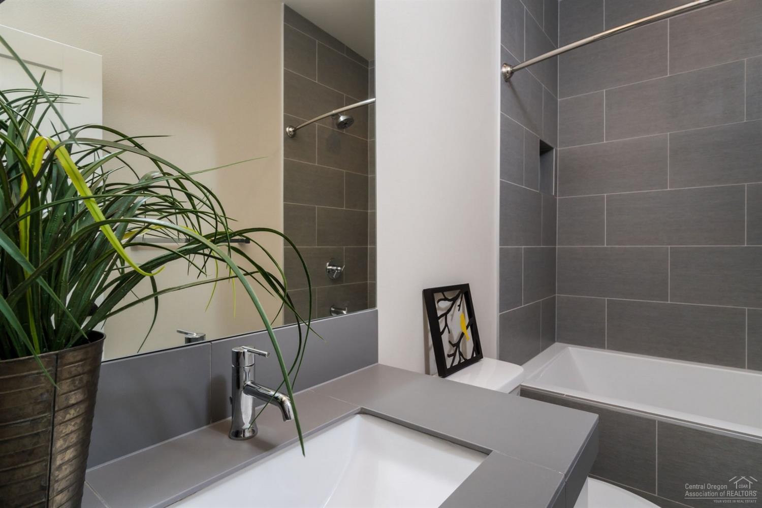 63193 Iner Loop Bend, OR 97701 - Photo 10 of 15 a bathroom with a bathtub and shower