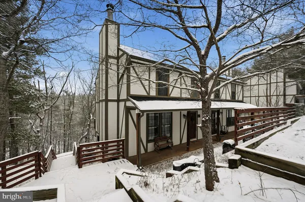 a view of a chairs and table in the patio