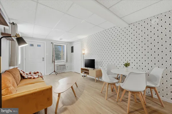 a view of a livingroom with furniture and wooden floor