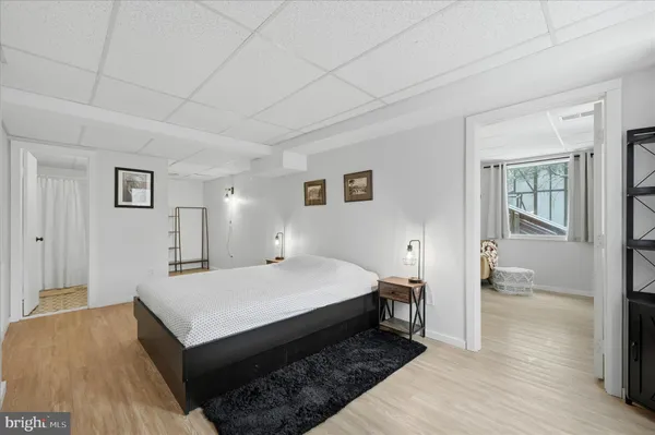 a bedroom with a bed and window