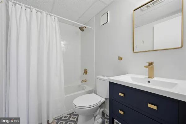 a view of a street with house in the background