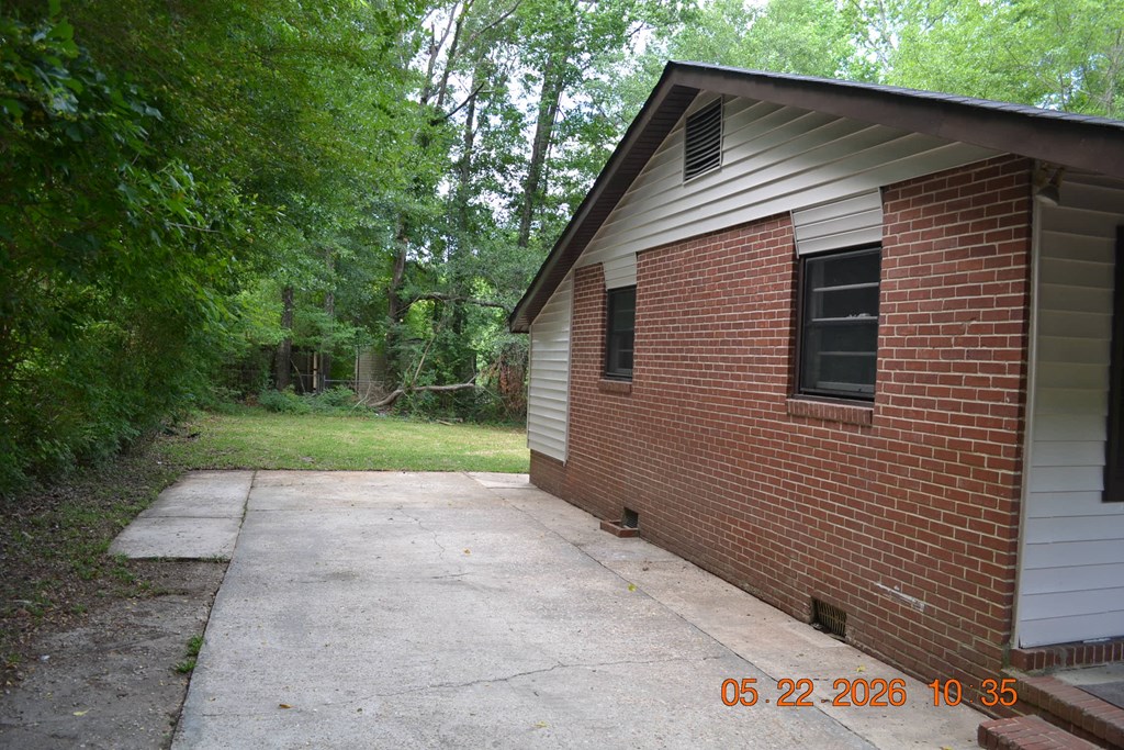 5552 Valleybrook Road Columbus, GA 31907 - Photo 26 of 27 a backyard of a house with lots of green space