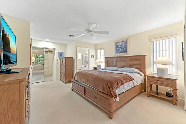 a living room with furniture a dining table and chairs with kitchen view